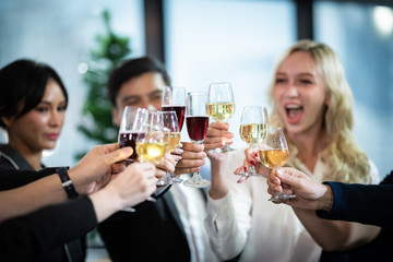 Toast to success. Group of business people toasting with champagne and smiling while standing close to each