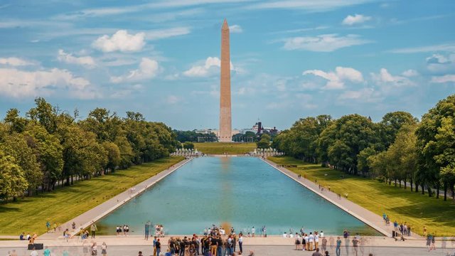 Beautiful Washington Monument on the Reflecting Pool in Washington, DC, USA at dawn. Time lapse view.