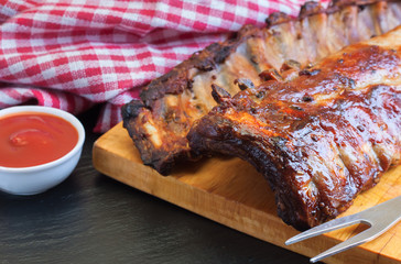 grilled pork ribs on a cutting board