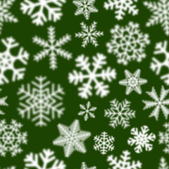 Naklejka na ściany i meble Christmas seamless pattern of white defocused snowflakes on green background