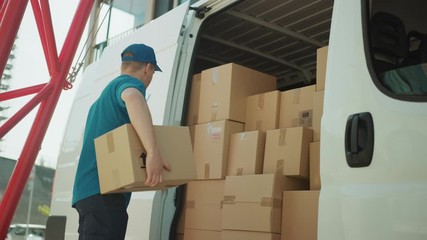 Courier Opens Delivery Van Side Door and Takes out Cardboard Box Package, Closes the Door and Goes on Delivering Postal Parcel. Slow Motion Low Angle