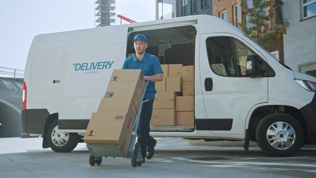 Courier Opens Delivery Van Side Door and Takes out Cardboard Box Package, Closes the Door and Goes on Delivering Postal Parcel.