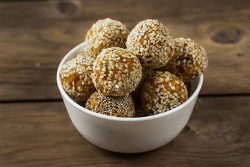 Raw healthy vegetarian food. Organic snack bites with dried apricots, dates, cashews and honey. Energy balls