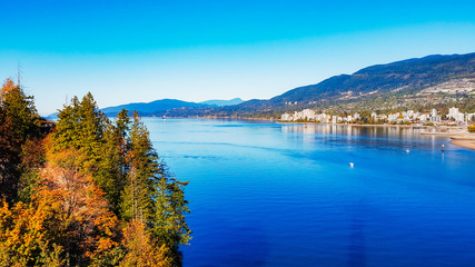 Fototapeta na wymiar Burrard Inlet and West Vanouver Viewed From Lionsgate Bridge On A bright EArly Fall Day