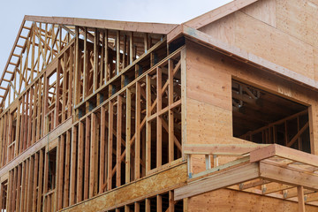 Fototapeta na wymiar Building construction, wood framing structure at new property development site