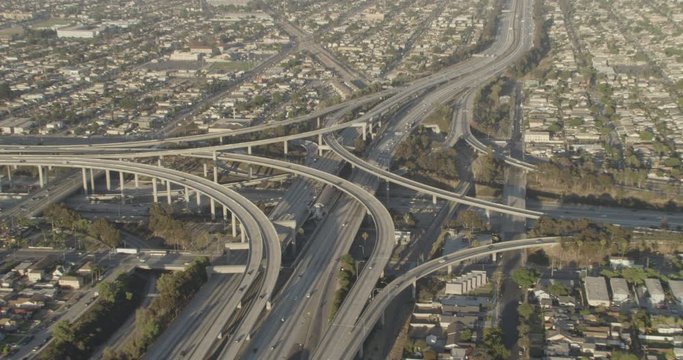 Aerial shot, day, high altitude shot and zoom on highway interchange in la, drone
