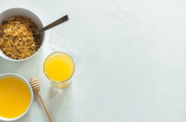 oatmeal breakfast with honey, healthy breakfast top view with copy space on a light background.