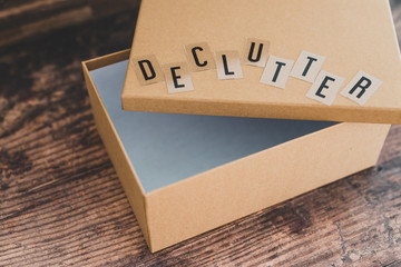 declutter message on top of semi-open empty box to fill with items to give away