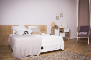 Interior of the beautiful bedroom with a vintage bed