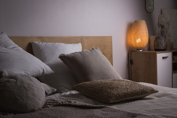 Interior of the beautiful bedroom with a vintage bed