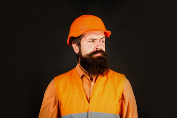 Builder in hard hat. Business, building, industry, technology. Man builder. Bearded man in overalls and construction helmet. Mechanical worker. Industrial worker. Construction worker in hardhat.