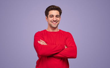 Cheerful man in red sweater with folded hand