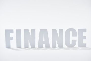 finance word with shadows on white background