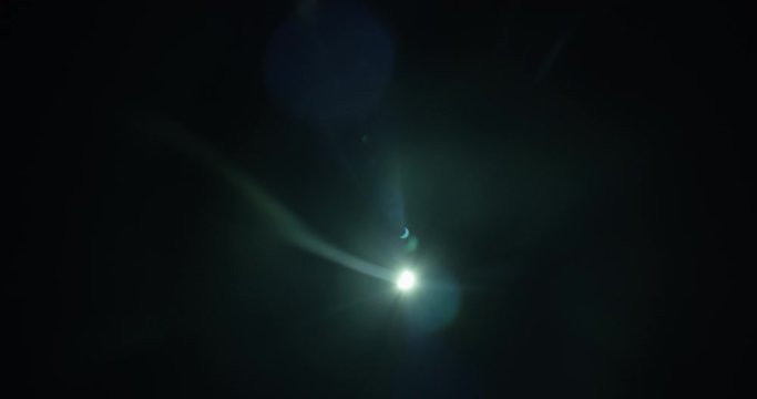 Aerial shot, night, shot of bright moon with partial eclipse, drone