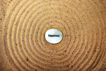 Fototapeta na wymiar Kindness Rock on Sand - Very Zen