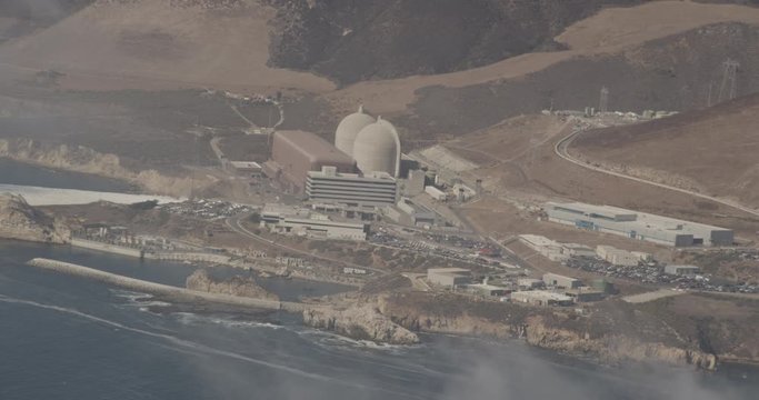 Aerial shot, day, zoom on industrial factory on california coast, drone