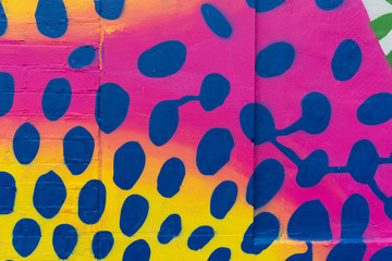 Brightly colored painted polka dots for festive background