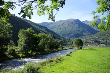 beautiful mountain landscape with Scandinavian meadows and a river, Norway