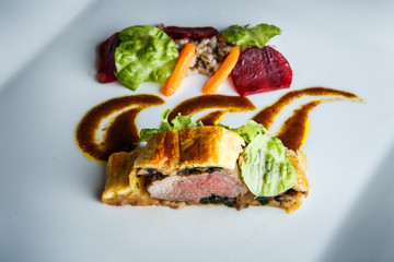 top view closeup modern dish of baked in dough meat with mushrooms