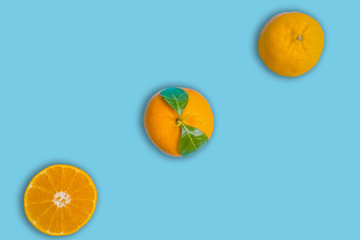 oranges and green leaf close up top view