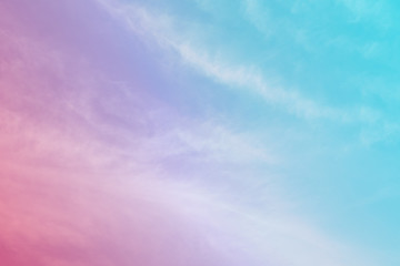 subtle rainbow pastel tone colors sky texture and abstract pattern of white cloud moving along the wind in spring season suitable for the environment or the fresh air of nature background concept