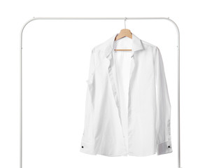 Rack with stylish shirt on white background