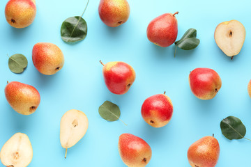 Sweet ripe pears on color background