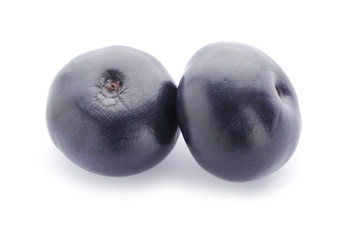 Fresh acai berries on white background