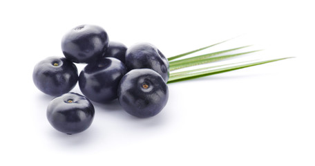 Fresh acai berries on white background