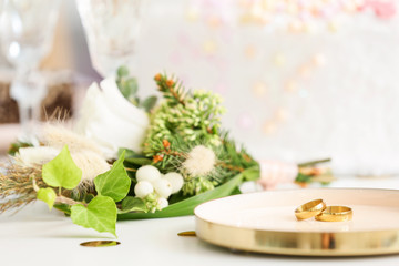 Plate with wedding rings on table. Concept of lesbian wedding
