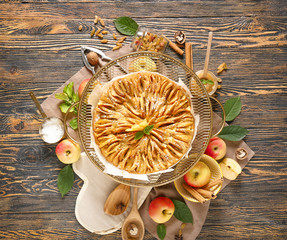 Sweet apple pie on wooden table