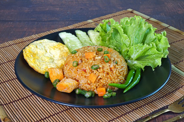 Spicy fried rice with chicken and fried egg. Thai food, Asian food