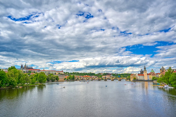 Fototapeta na wymiar A view of Old Town Prague and the Charles Bridge across the Vltava River in Prague, Czech Republic.