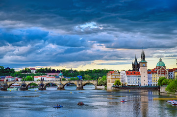 Obraz premium A view of Old Town Prague and the Charles Bridge across the Vltava River in Prague, Czech Republic.