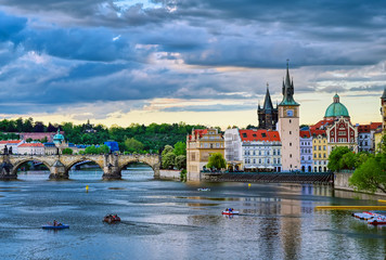 Obraz premium A view of Old Town Prague and the Charles Bridge across the Vltava River in Prague, Czech Republic.