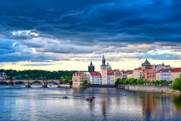 Naklejka premium A view of Old Town Prague and the Charles Bridge across the Vltava River in Prague, Czech Republic.