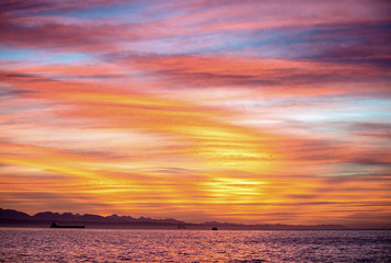 Naklejka na ściany i meble Seascape. Clouds, red sunrise sky, Mossel bay. South Africa.