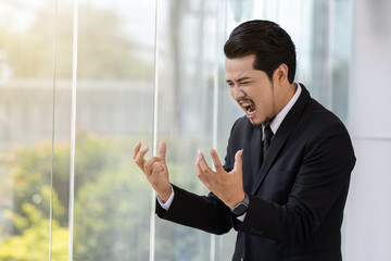 stressed business man thinking about problem in office