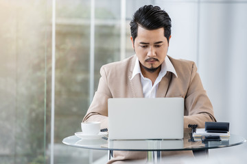 business man using laptop computer