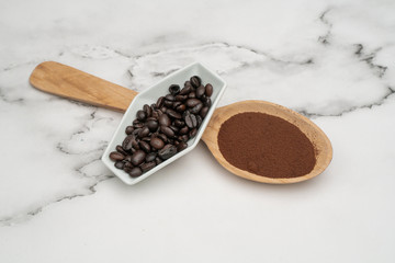 Roasted coffee beans, ground coffee, Cup of coffee, Wooden spoon with roasted coffee