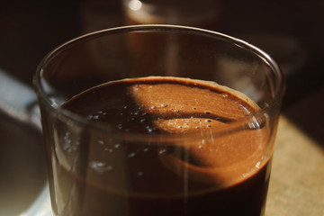 glass of cacao on dark background