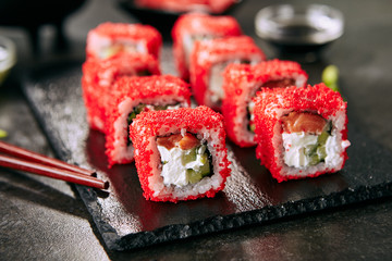 Alaska salmon uramaki sushi restaurant menu with rice, cream cheese, salmon, cucumber, flying fish...