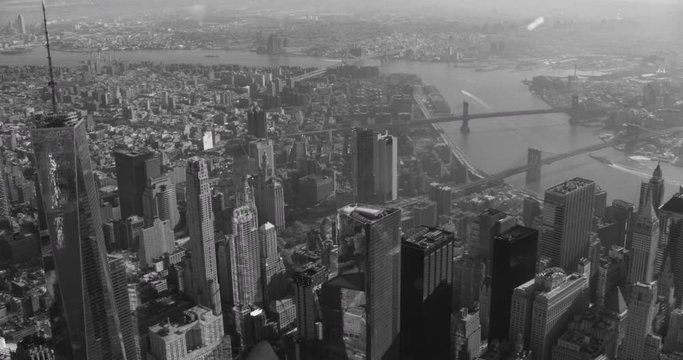 Black and white aerial shot, pan over financial district , One World Trade center left-focused, drone