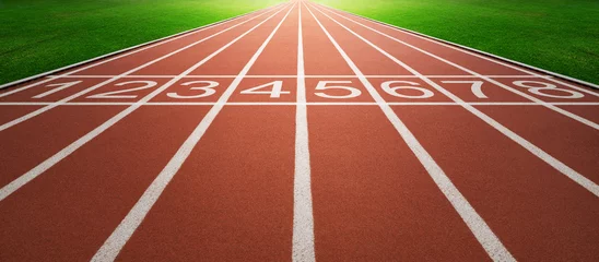 Selbstklebende Fototapeten Athlete running track with number on the start . Perspective wide angle . © jamesteohart