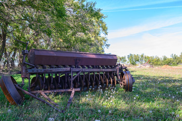 Fototapeta premium old ruted farm seeder 