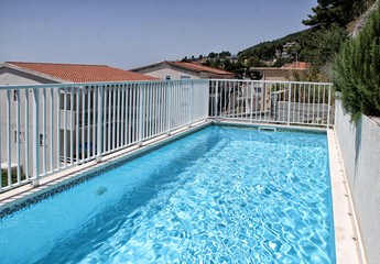 Swimming-pool on roof of house with clean water