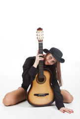 Girl in a hat with a guitar