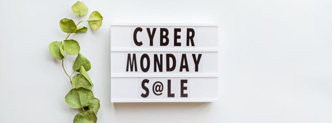 Creative promotion composition Cyber monday sale text on lightbox, eucalyptus branch on white background. Horizontal banner for web design. Flat lay, top view, overhead, mockup, copy space, template - Powered by Adobe