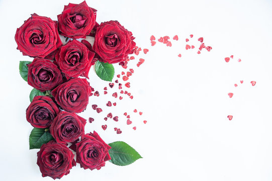 Flat Lay Background, flower pattern, Valentine's Day, the theme of lovers. Red roses on a white background, isolated. Space for texr