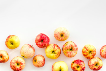 Autumn composition with fresh apples on white background top view pattern space for text frame